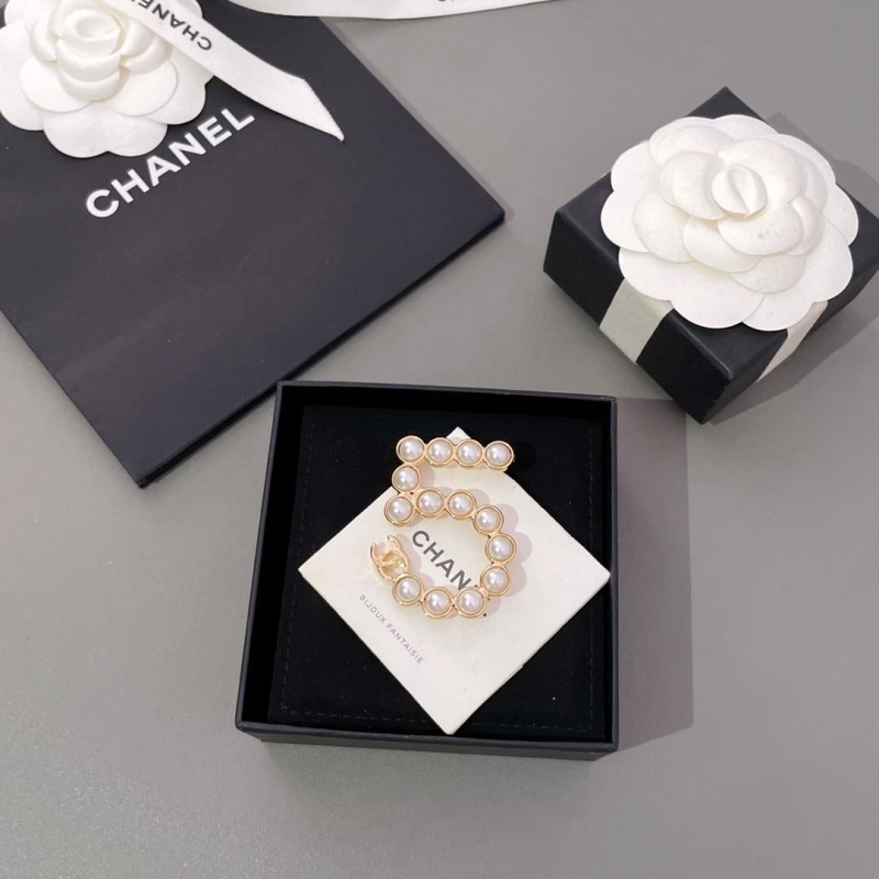 Ch*el brooches